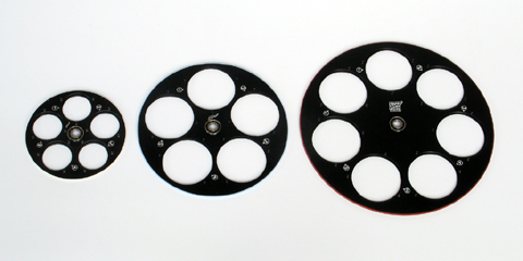 Internal filter wheel of G2 camera for five 31�mm filters (left), internal filter wheel of G3 camera for five 50�mm filters (center) and external filter wheel for G3/G4 camera for seven 50�mm filters (right)