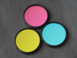 RGB filters in 2" threaded cells for G3 camera (visible in complementary colors on black background)